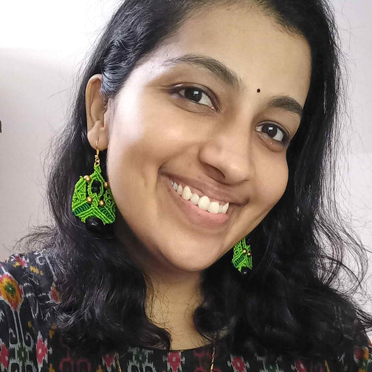 MacramΓ© dangle earrings with black faceted focal beads