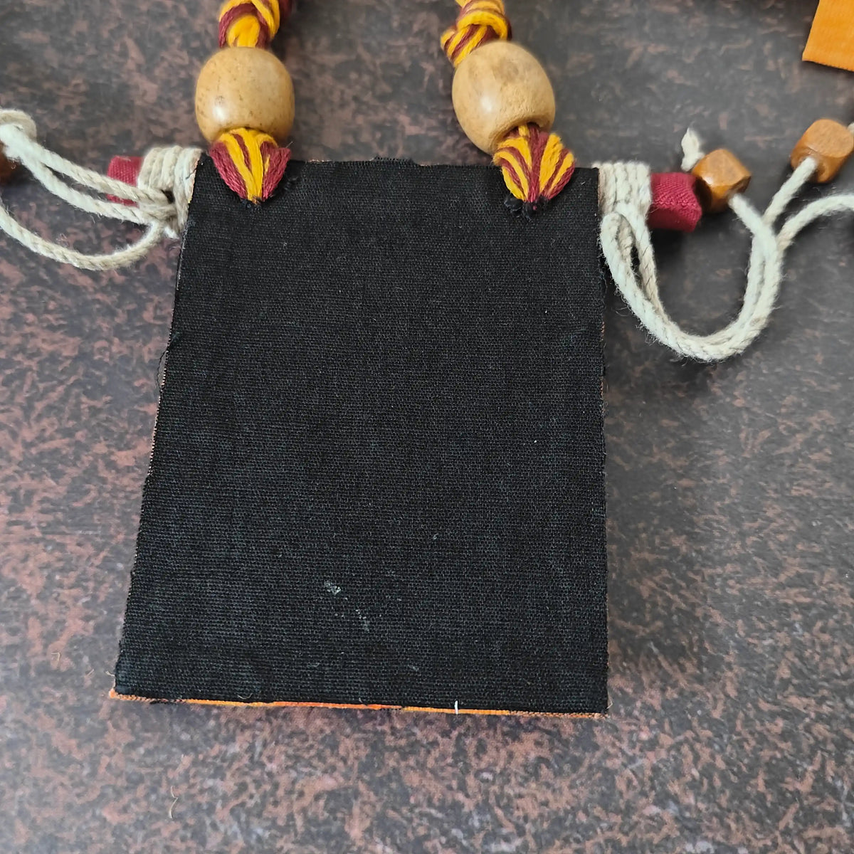 Mrinmayi orange fabric necklace set