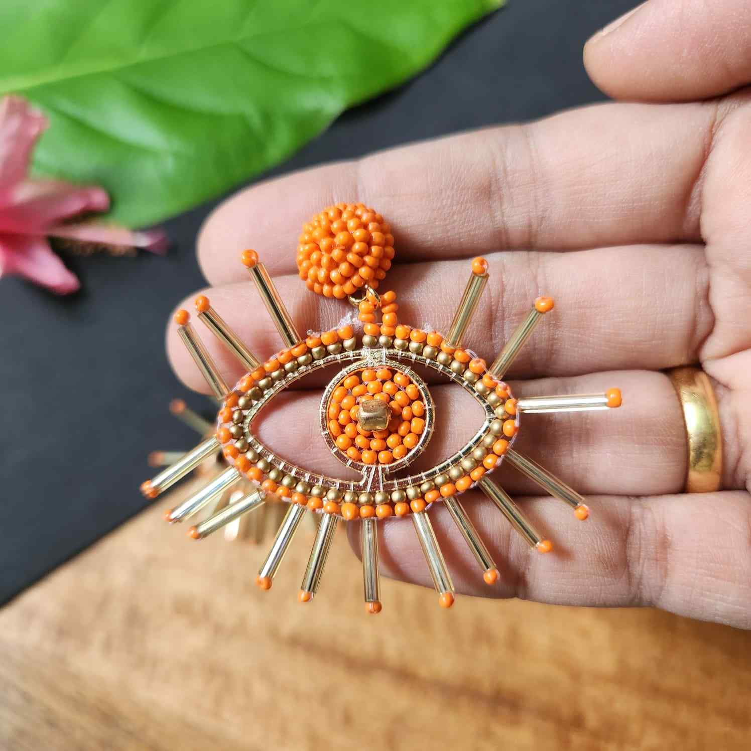 evil eye earrings for party wear earrings in orange gold seed beads earrings stud danglers large earrings for saree lehenga wedding sangeet mehendi reception party earrings