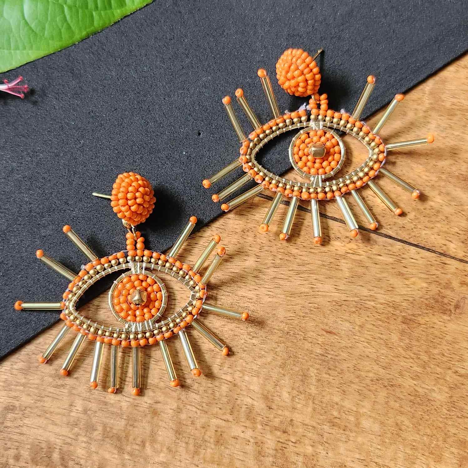 evil eye earrings for party wear earrings in orange gold seed beads earrings stud danglers large earrings for saree lehenga wedding sangeet mehendi reception party earrings