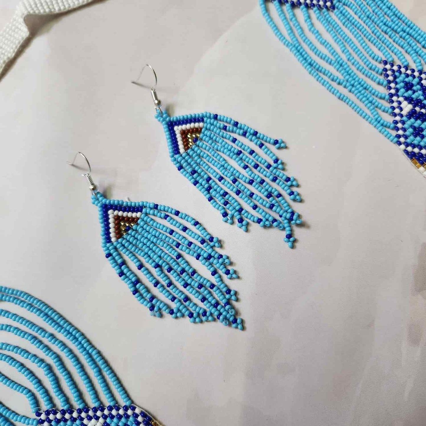blue geometric necklace layered bead necklace for party dangler earrings for office wear haldi wedding wear necklace set
