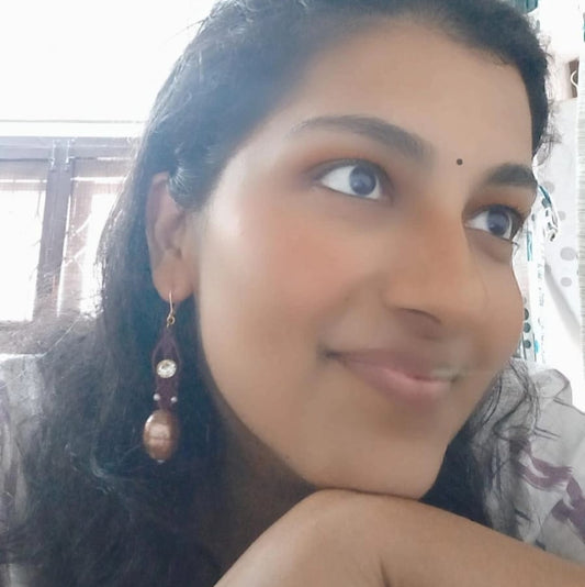 Long macrame dangler in maroon with coppery lampwork bead and white rhinestone party wear earrings for round face