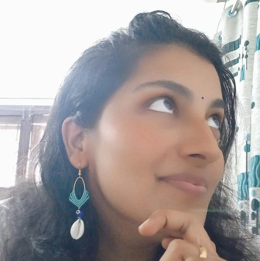 cowrie shell dangler earrings with evil eye bead