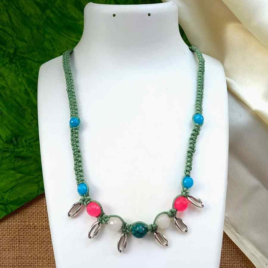 Kaparda silver cowrie macrame statement necklace