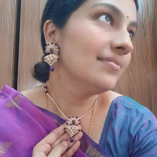 beige macrame pendant earrings set with faceted metallic purple beads