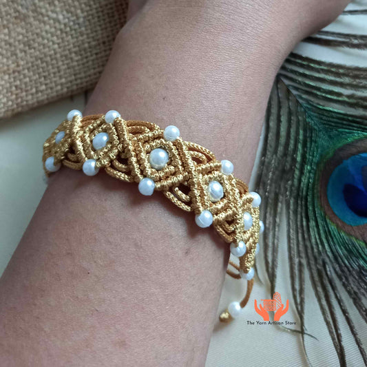 bead macrame bracelet with a repeating diamond motif