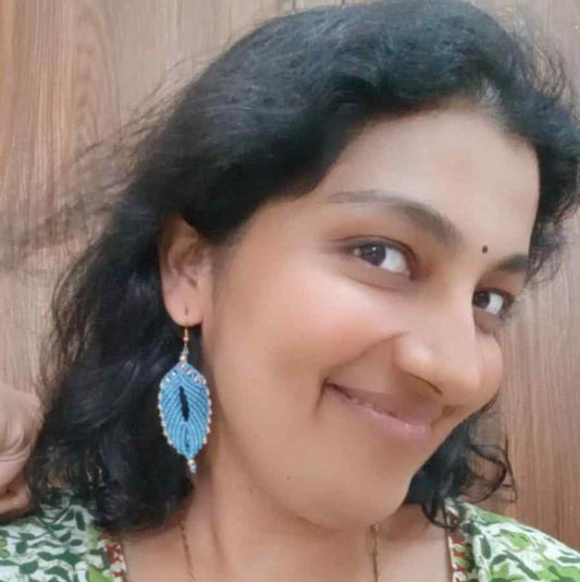 blue leaf like macrame earrings with brass beads