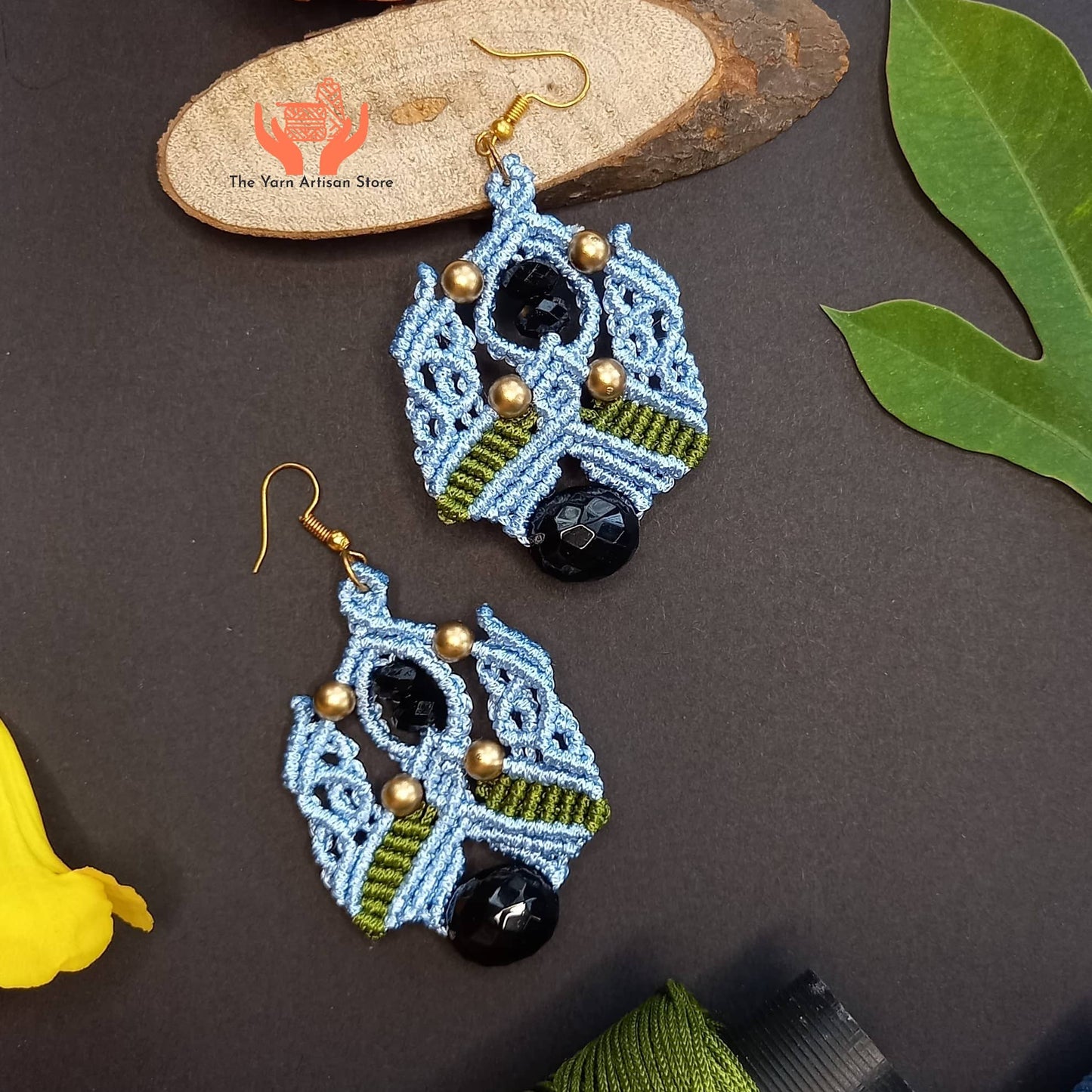 Macramé dangle earrings with black faceted focal beads
