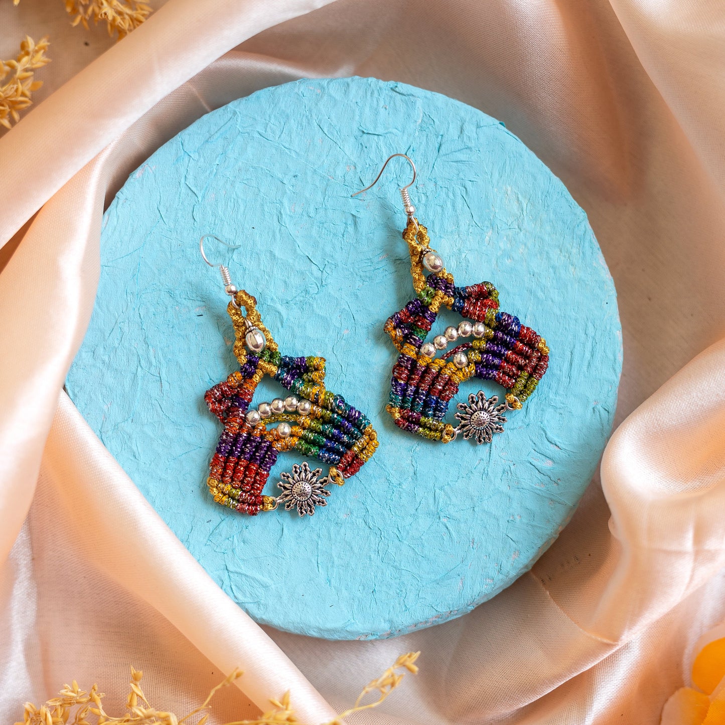 macrame dangler earrings with floral charm and gunghroo beads