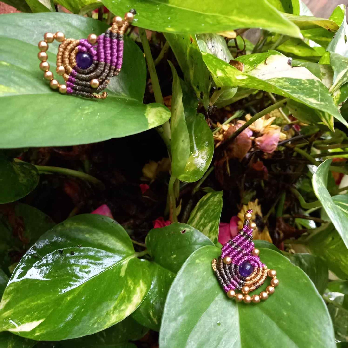 macrame pendant earrings set in the shape of a butterfly featuring amethyst stones and agate beads