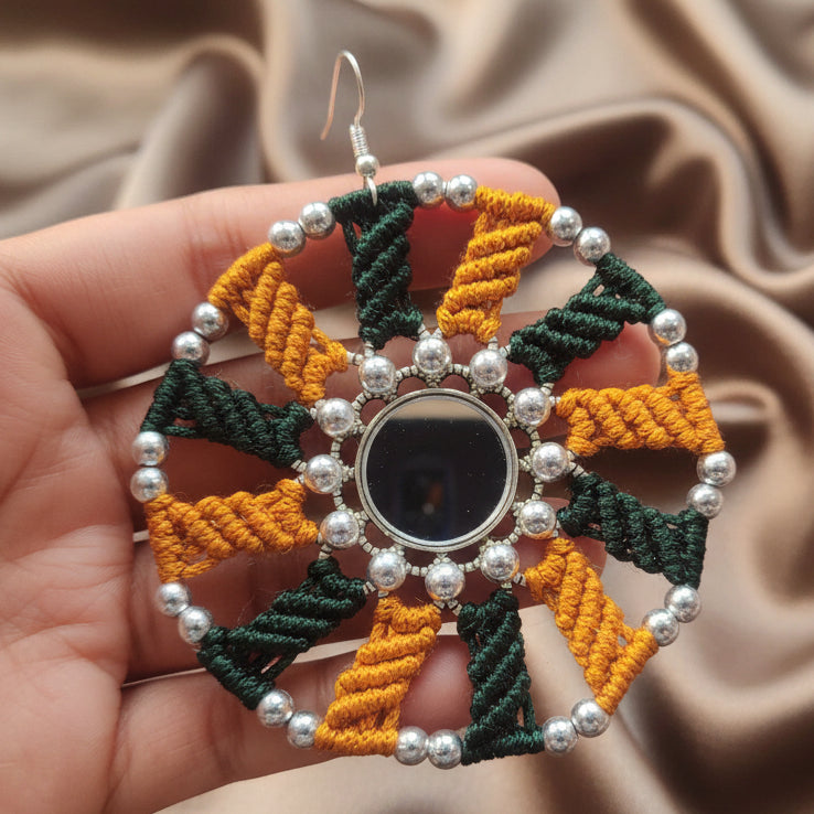 silver mirror earrings with macrame work in dark green and mustard