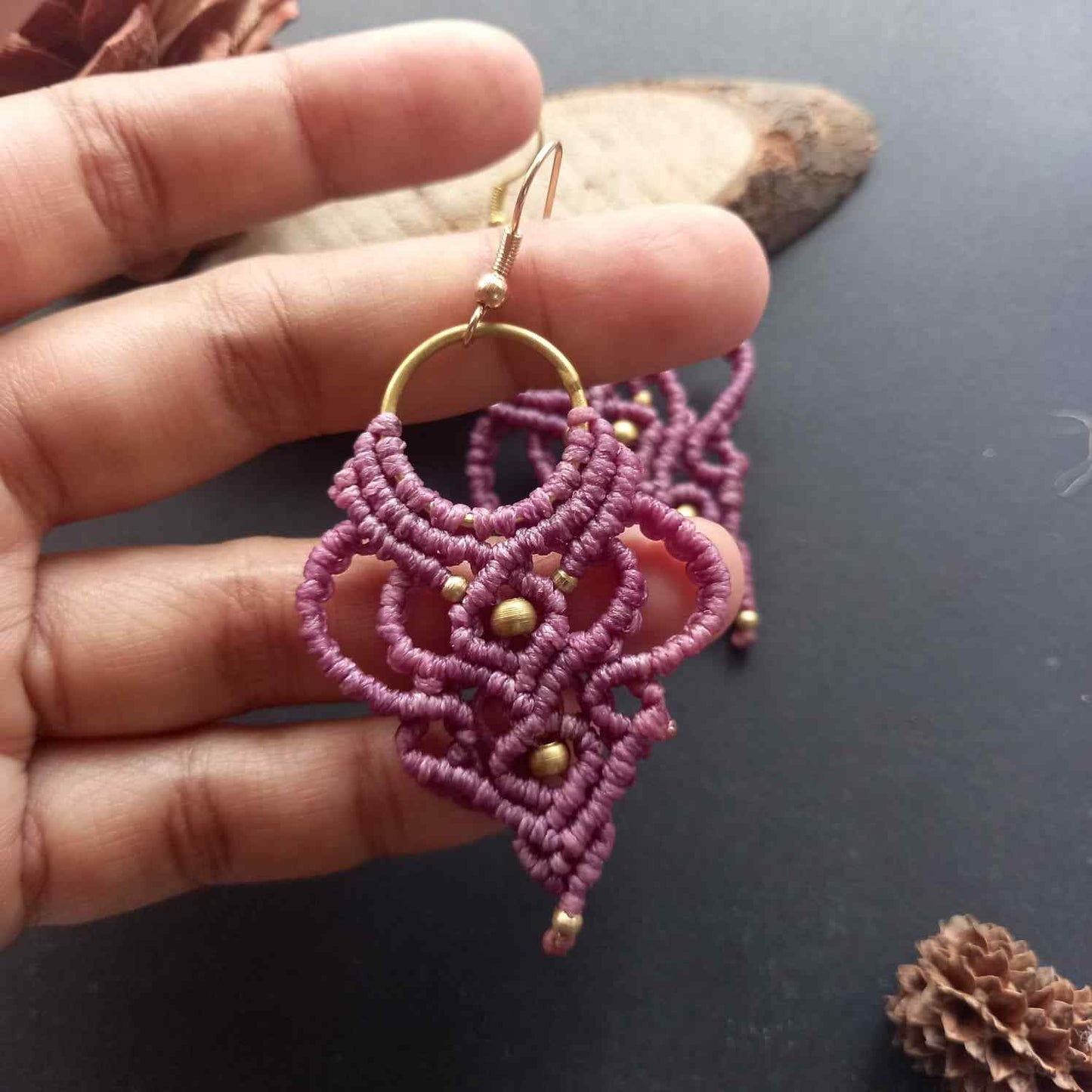 purple handmade macrame earrings with a lace like design and brass beads