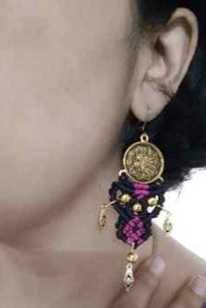 tribal style macrame dangler earrings with a floral coin and filigree diamond shaped charms