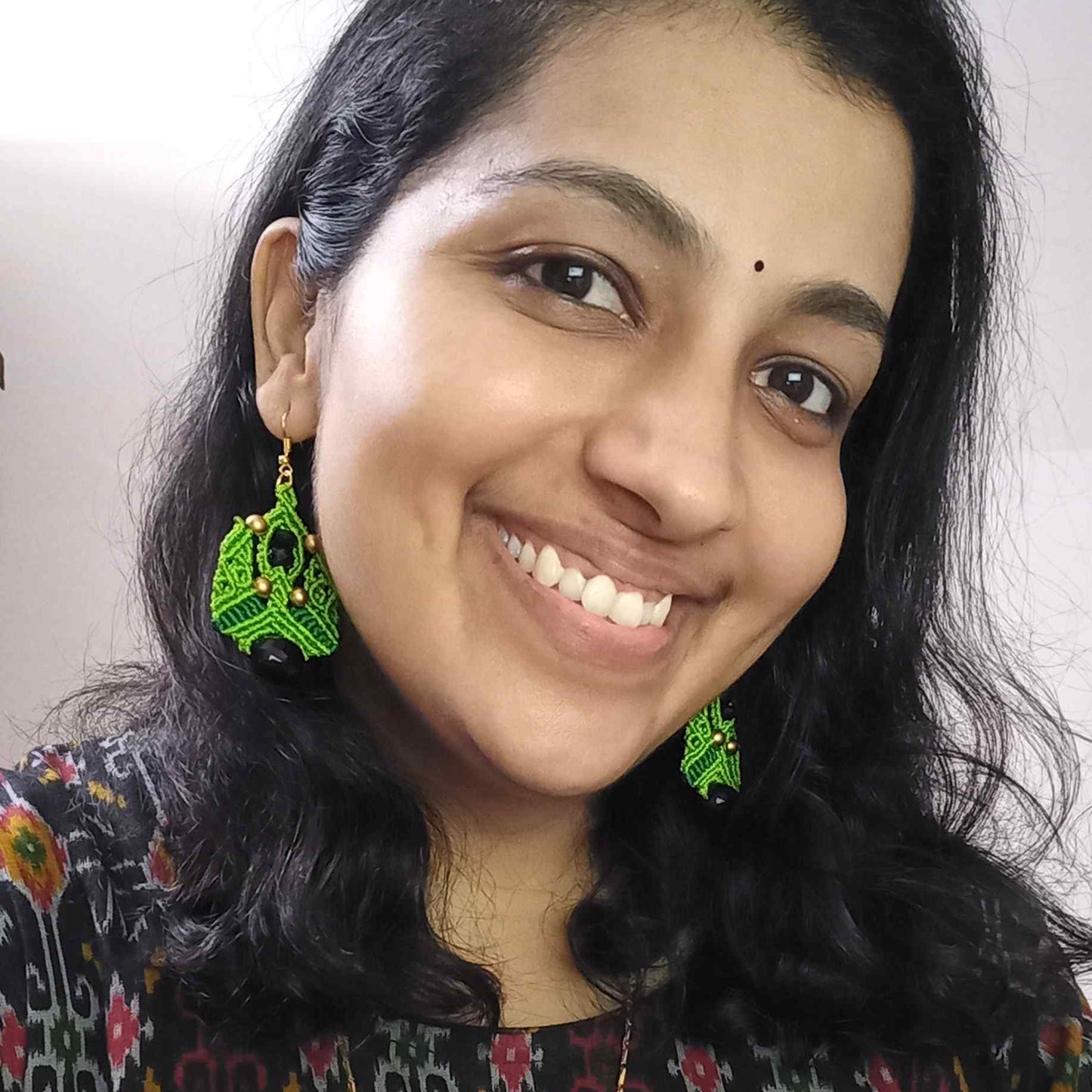 Macramé dangle earrings with black faceted focal beads