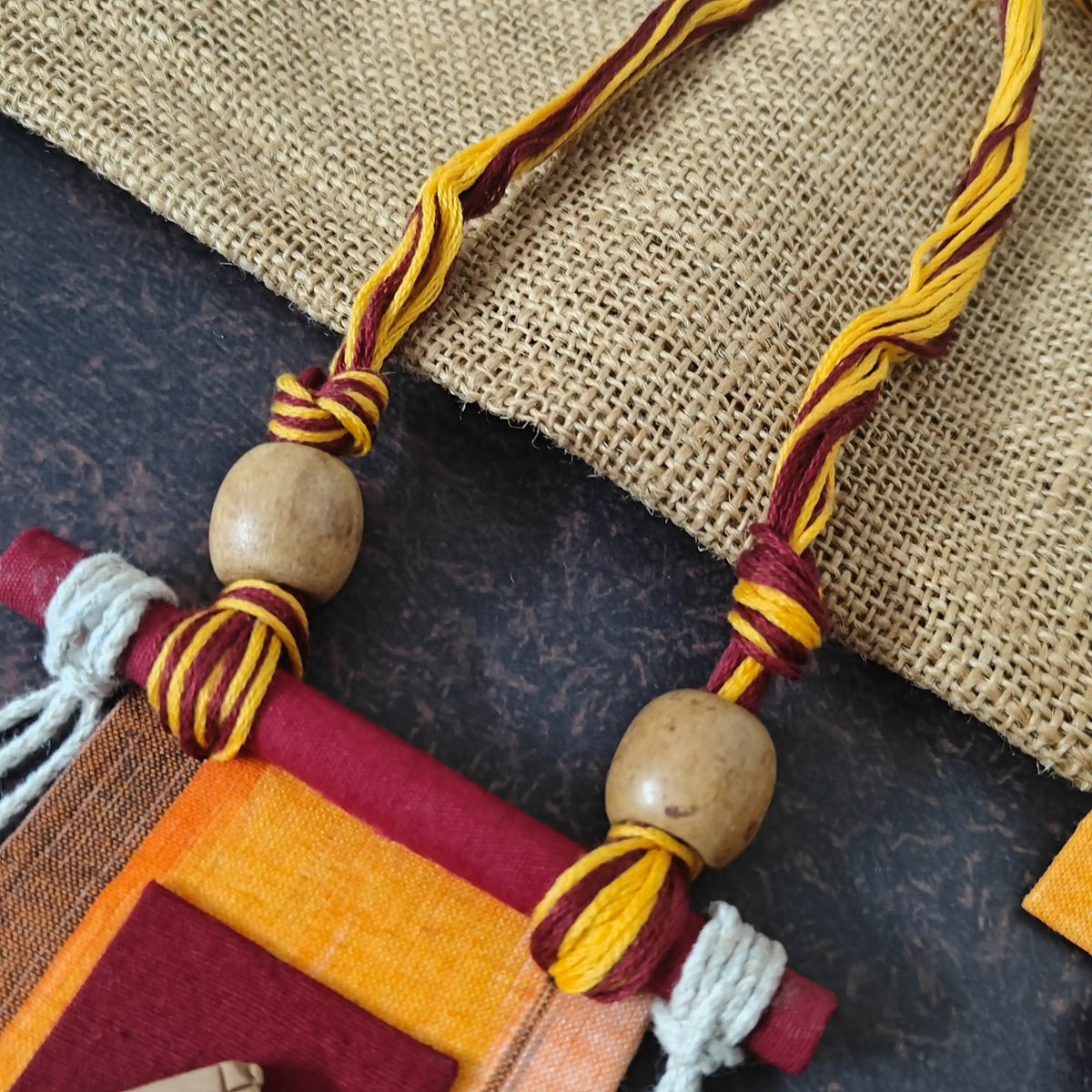 Mrinmayi orange fabric necklace set
