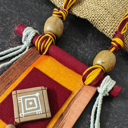 Mrinmayi orange fabric necklace set