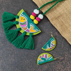 Pratima green fabric necklace set — semicircular pendant with a hand-painted fish and green cotton thread tassels, with small matching fish earrings