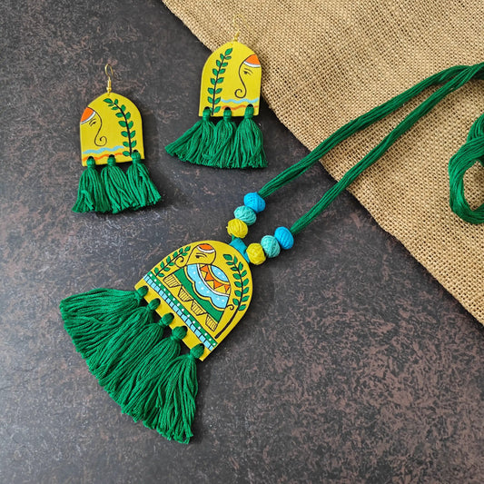 Rangini green fabric necklace set — semicircular pendant with a hand-painted elephant and green cotton thread tassels, with matching semicircular earrings
