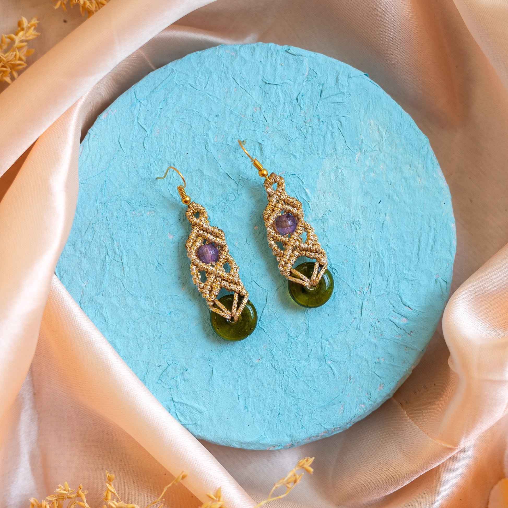 macrame dangler earrings with green doughnut beads