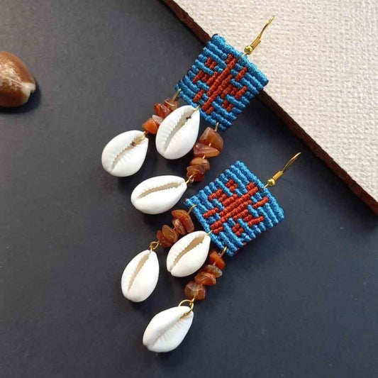 cowrie shell earrings with onyx beads and cavandoli sun motif