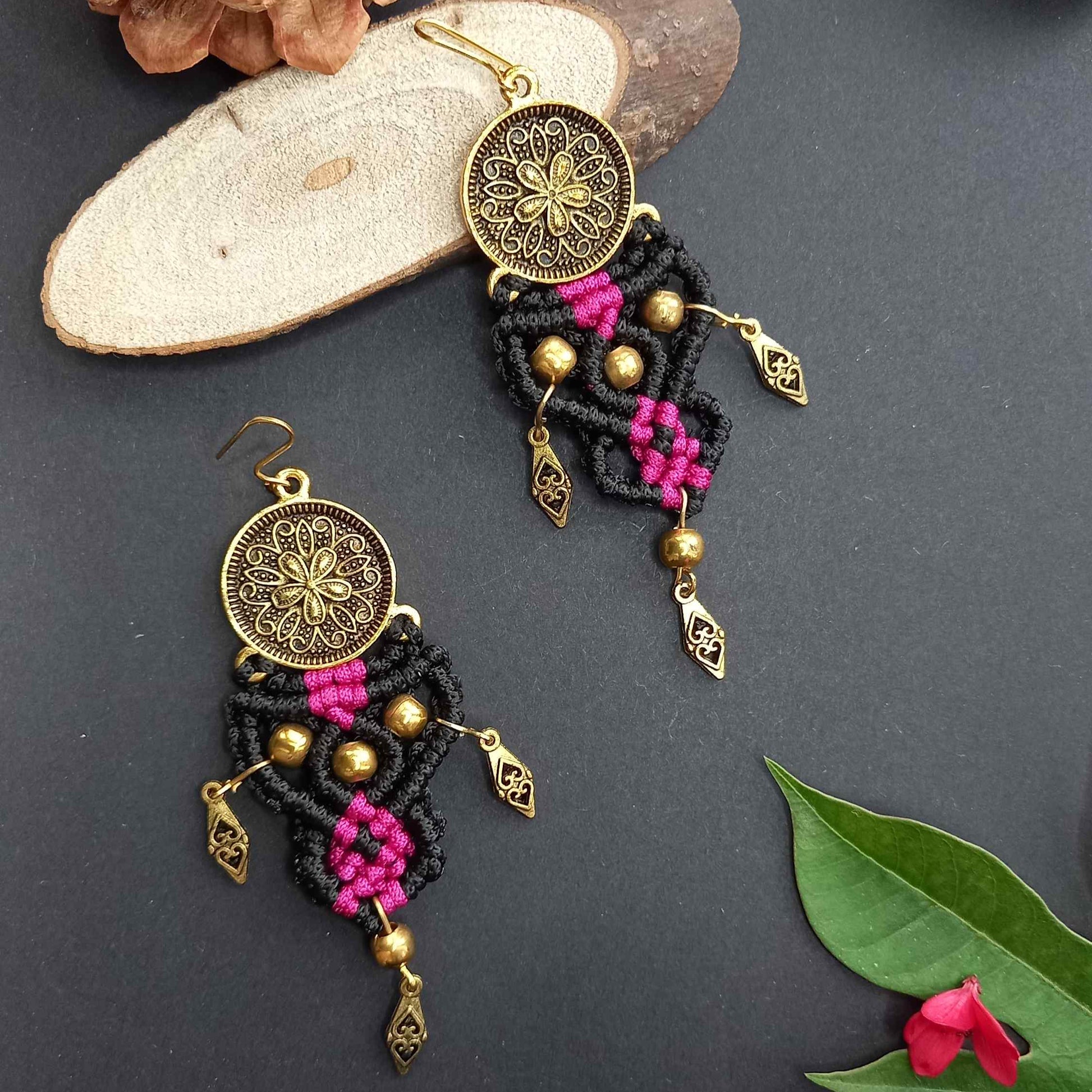 tribal style macrame dangler earrings with a floral coin and filigree diamond shaped charms