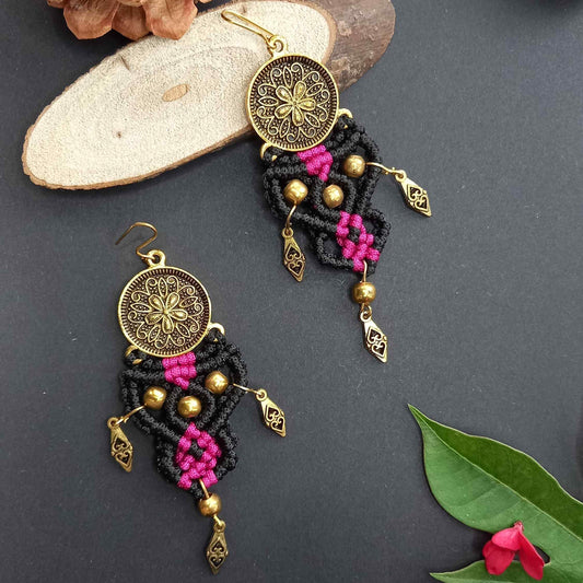 tribal style macrame dangler earrings with a floral coin and filigree diamond shaped charms
