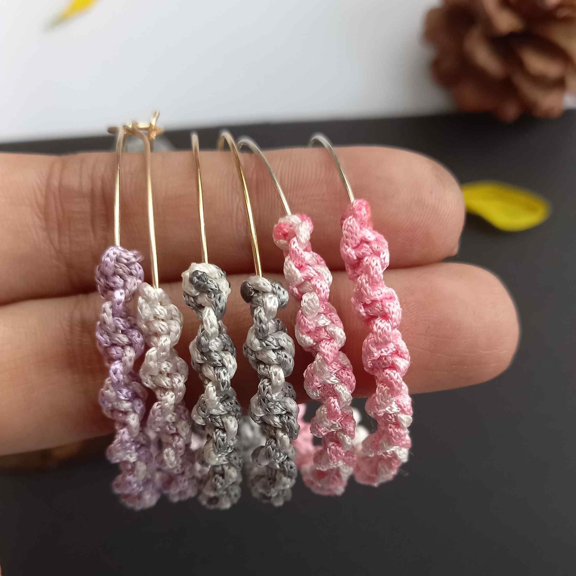 Macramé hoop earrings in variegated colours with twist design