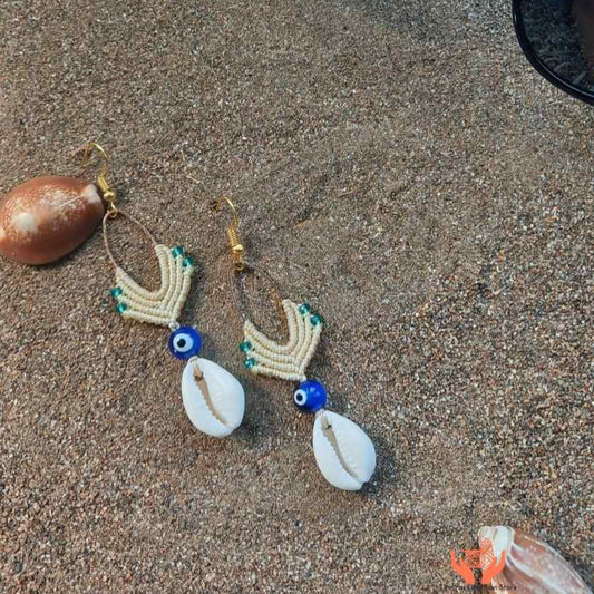 cowrie shell dangler earrings with evil eye bead