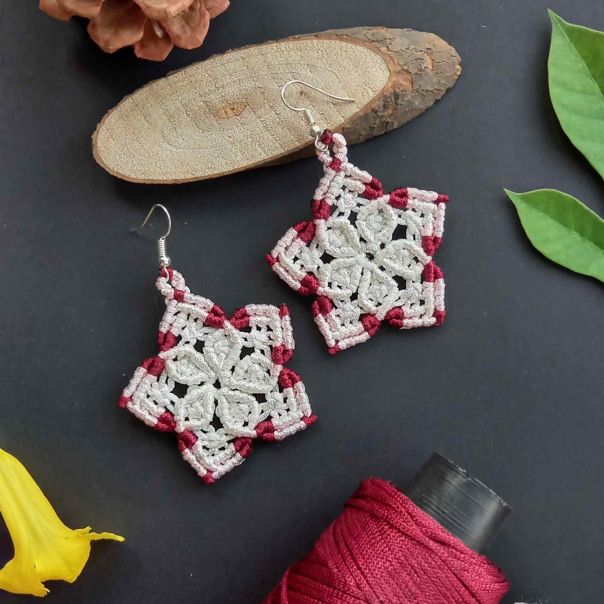 macrame five petalled floral dangler earrings in white and maroon
