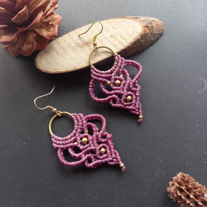 purple handmade macrame earrings with a lace like design and brass beads