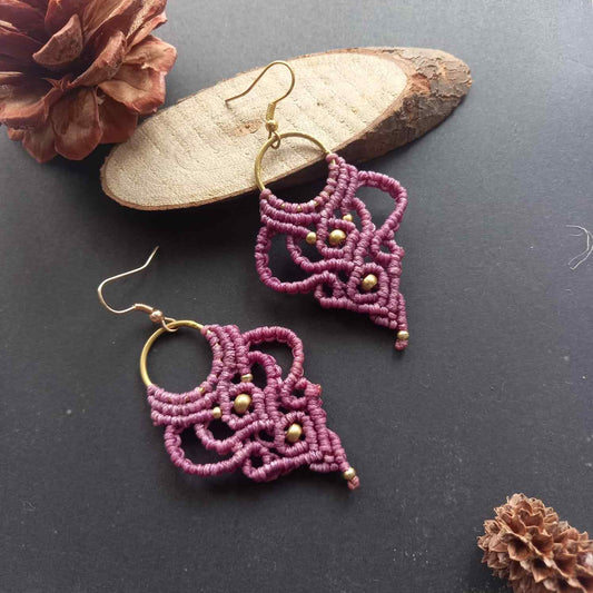 purple handmade macrame earrings with a lace like design and brass beads