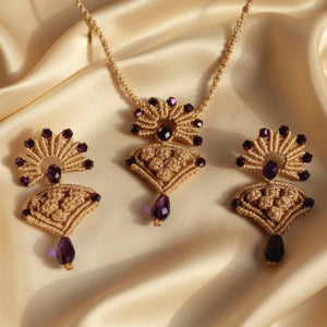 beige macrame pendant earrings set with faceted metallic purple beads