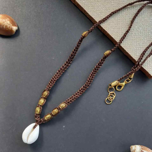 cowrie shell and gold bead necklace