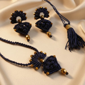 blue macrame pendant earrings set with faceted metallic purple beads