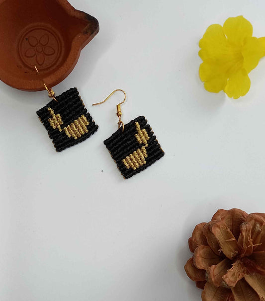 macrame earrings with a lamp design made using the cavandoli technique
