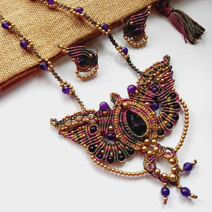 macrame pendant earrings set in the shape of a butterfly featuring amethyst stones and agate beads