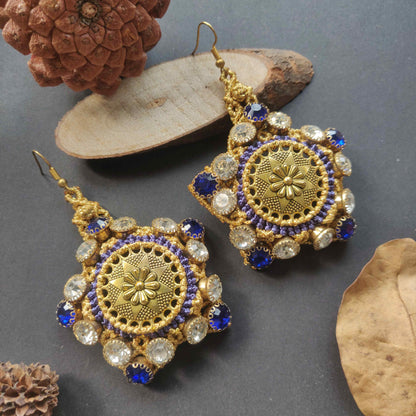 gold stone earrings with blue and white rhinestones