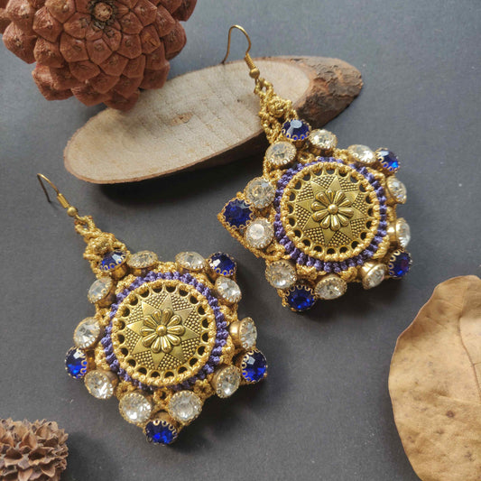 gold stone earrings with blue and white rhinestones