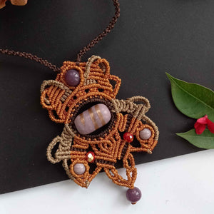 macrame statement necklace with a handmade lampwork bead center