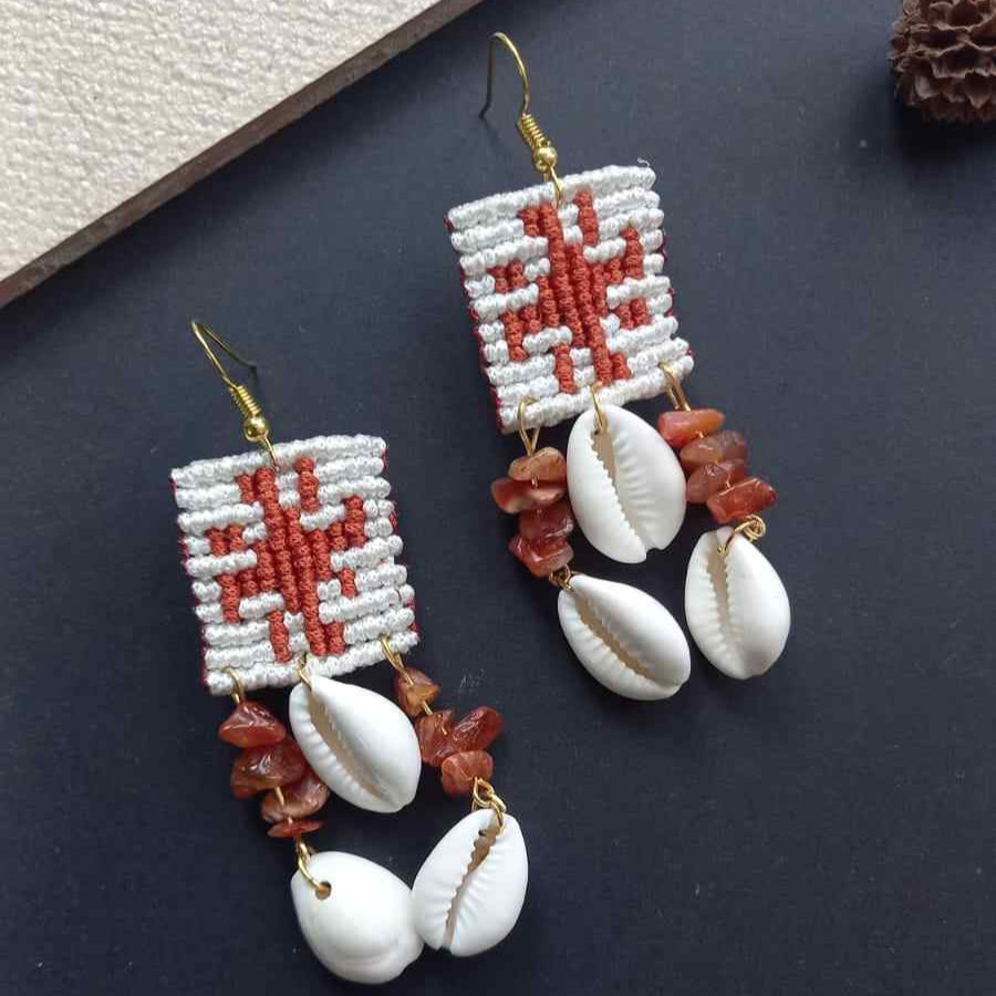 cowrie shell earrings with onyx beads and cavandoli sun motif