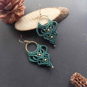 dark green handmade macrame earrings with a lace like design and brass beads