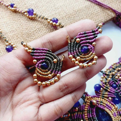 macrame pendant earrings set in the shape of a butterfly featuring amethyst stones and agate beads