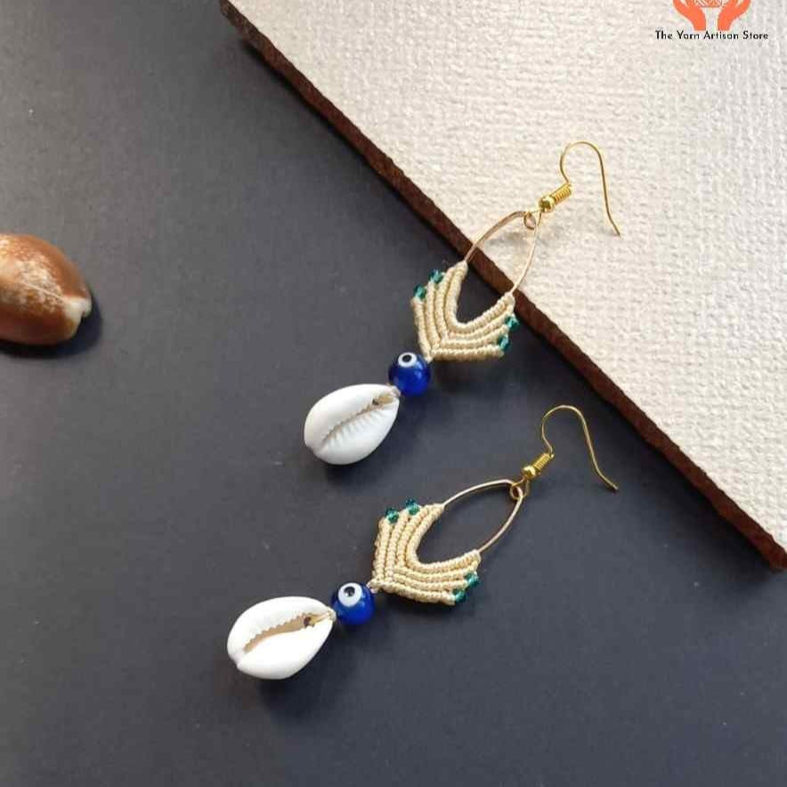cowrie shell dangler earrings with evil eye bead
