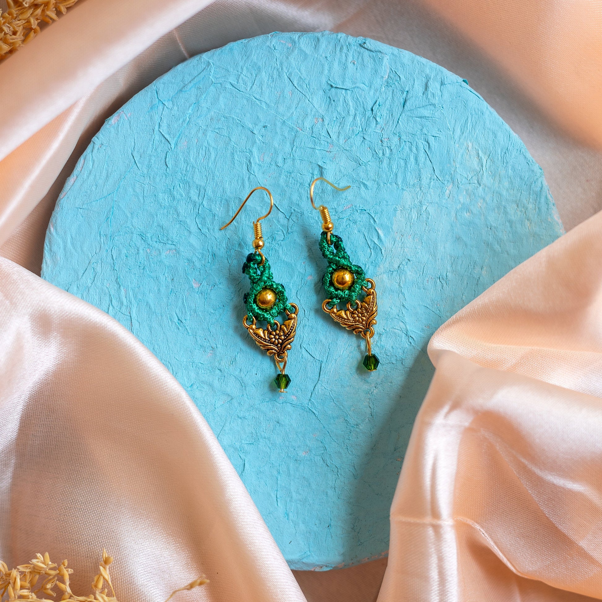 small macrame dangler earrings with dual leaf charm and crystal bead drop