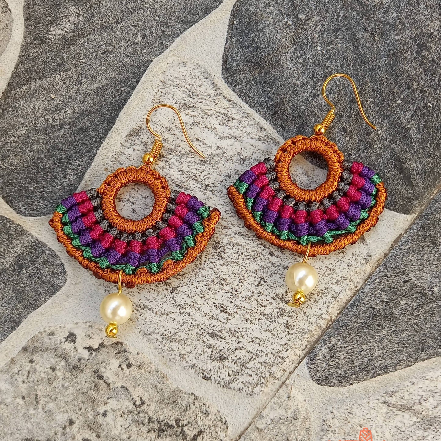 semicircular macrame dangler earrings with multiple colours and pearl beads