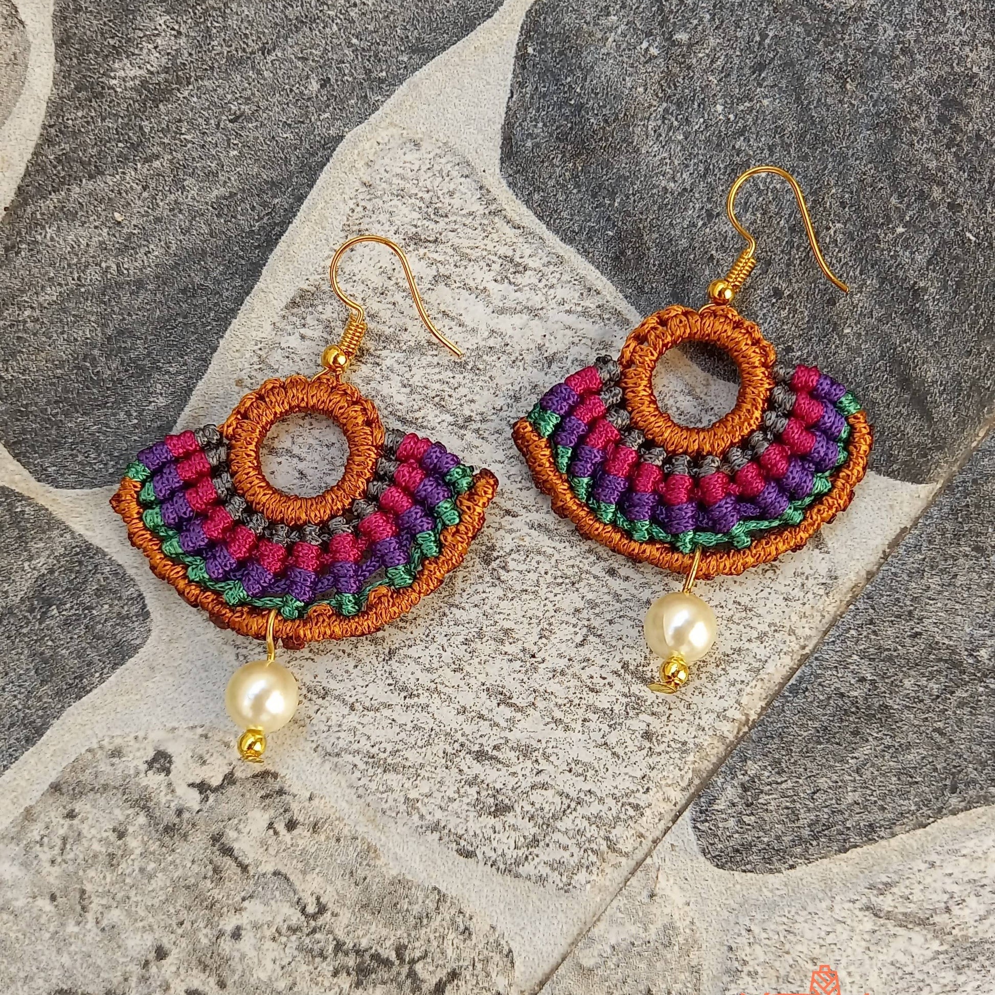 semicircular macrame dangler earrings with multiple colours and pearl beads