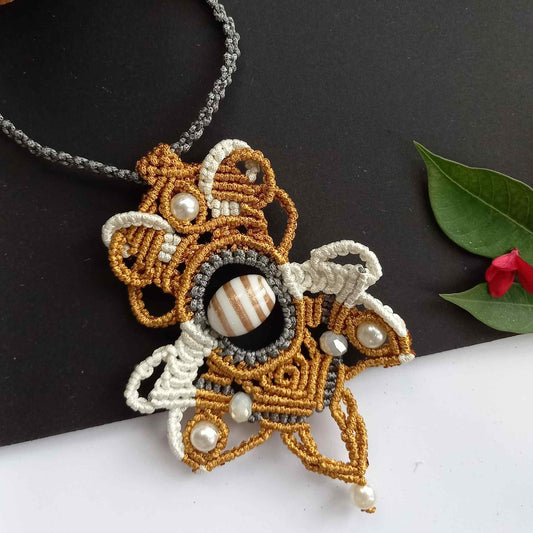 macrame statement necklace with a handmade lampwork bead center