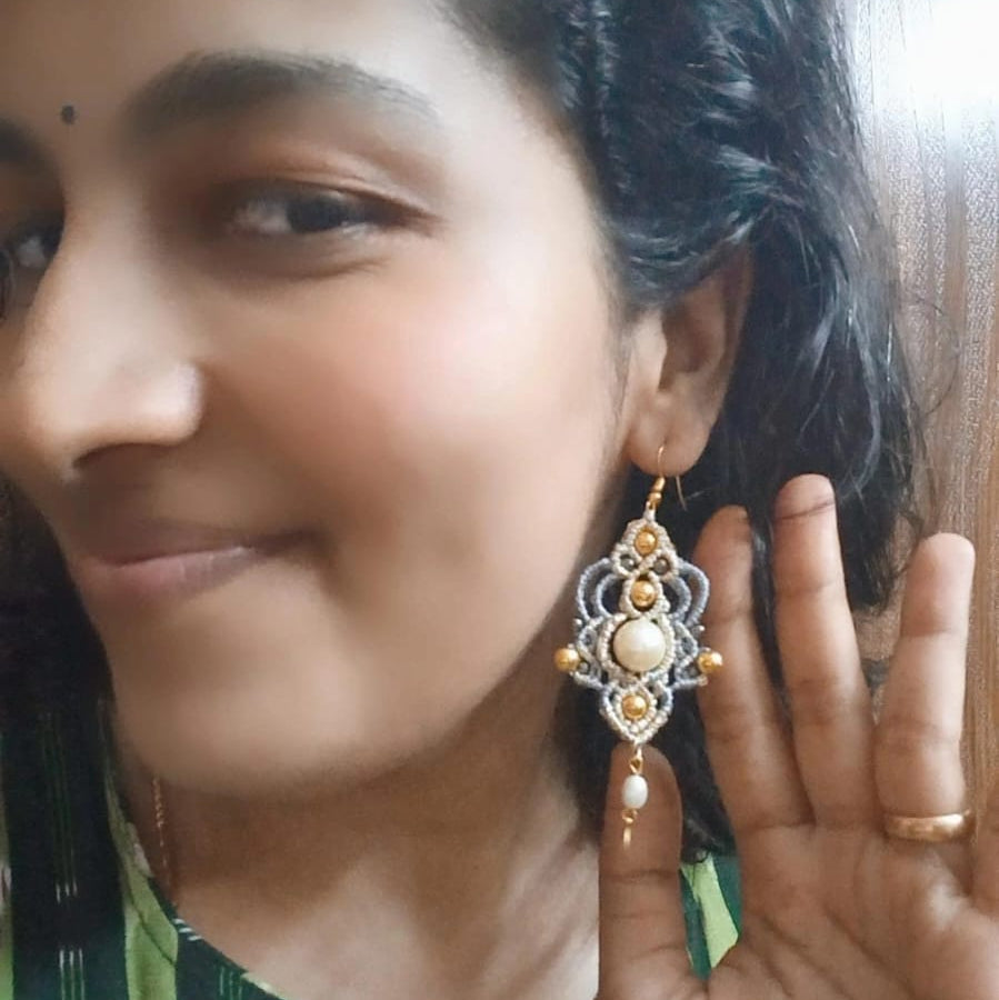 macrame dangler earrings with a pearl center and gold coin charm